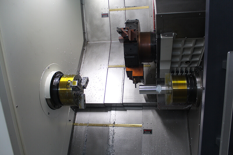 Dual spindle CNC turning centerfor transmission shafts